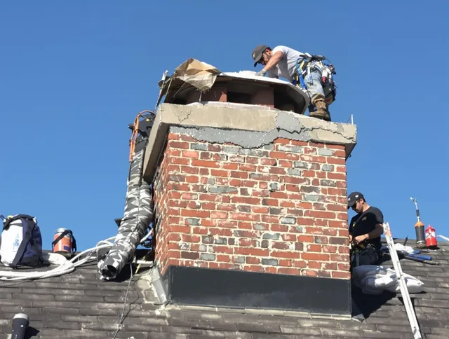 East Bridgewater Chimney Sweep installing a custom chimney crown in East Bridgewater, MA