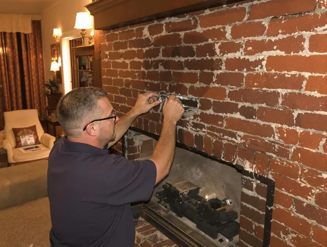East Bridgewater Chimney Sweep expert fixing a fireplace in East Bridgewater, MA